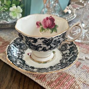 Elegant Black Lace Pattern Porcelain Teacup and Saucer with Pink Floral Accent